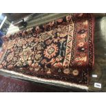 A red ground Kazak carpet 202 x 127