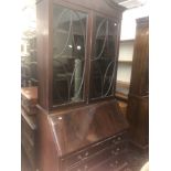 A mahogany bureau bookcase