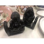 A pair of bronze figural bookends