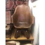 A carved wood tub chair