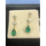 A pair of 18ct white gold emerald and diamond drop earrings carat weight approximately 2 ct total