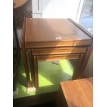 A mid century teak retro nest of three tables