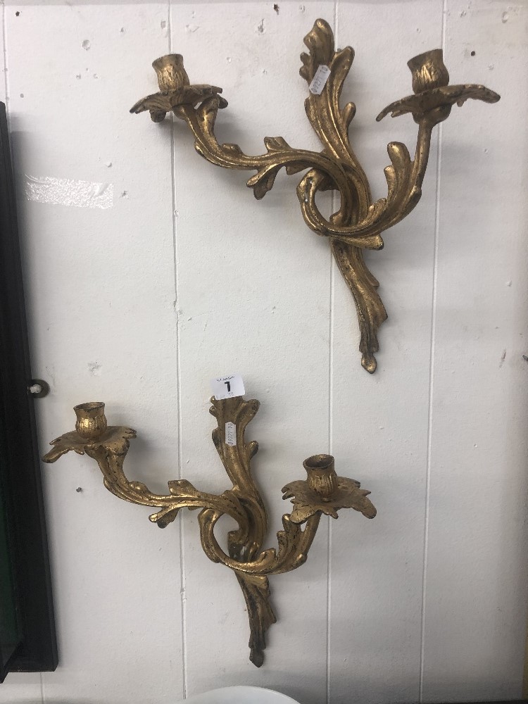 A pair of gilt two branch wall sconces