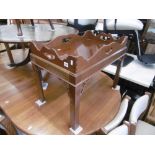 A mahogany butlers tray table