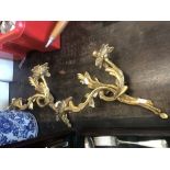 A pair of gilt two branch wall sconces