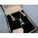 A pair Tahitian pearl and diamond drop earrings and matching necklace set in 18ct gold, 1.5ct.