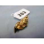 A fine gold nugget set on a brooch with an uncut diamond,