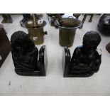 A pair of bronze figural bookends