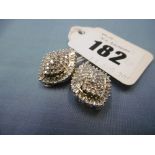 A pair of 14ct gold earrings set with approx.