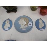 A pair of 19th century Wedgewood Jasper medallion plaques and one other 19th century plaque