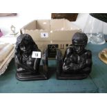 A pair of bronze figural bookends