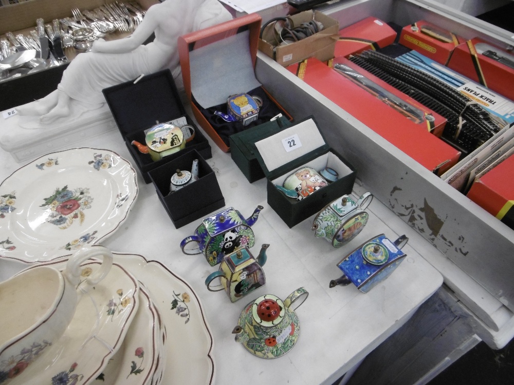 A qty of miniature enamel teapots