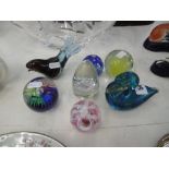 A quantity of glass paperweights