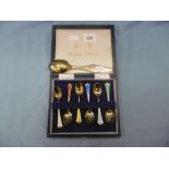 A set of six Anderson gilt silver and enamel coffee spoon and a Christmas spoon dated 1967