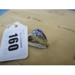 A 18k white metal tanzanite and diamond ring,