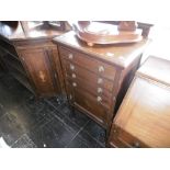 An inlaid mahogany music cabinet