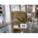 A small Swiss brass clock
