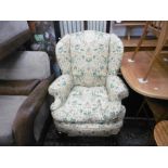 A pair of wing armchairs plus one other