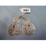 A pair of gemstone set 14ct gold earrings