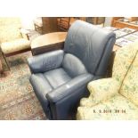 A blue leather reclining arm chair