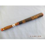 A Victorian turned wood truncheon painted with a rampant lion supporting word "Don" over "VR" on a