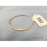 A 9ct hm gold bangle, 6 grams.