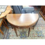 A 19th century inlaid mahogany fold over tea table