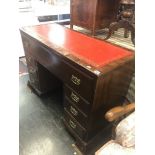 A mahogany leather topped desk