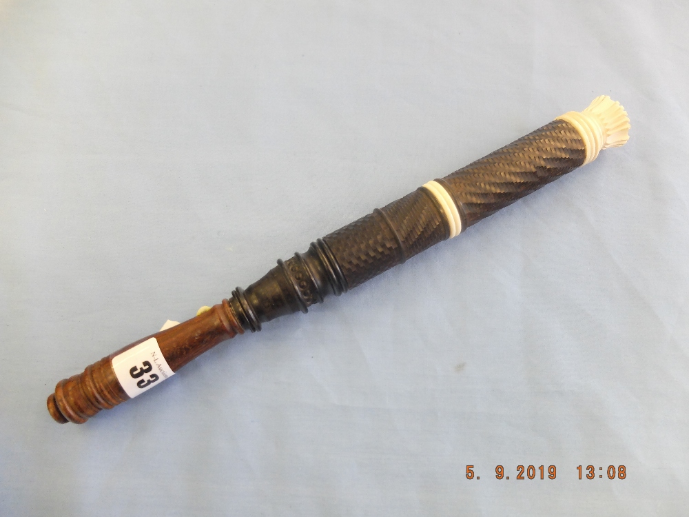 An Edwardian Indian engine turned hardwood truncheon with carved crown length 12.