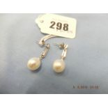 An 18ct white diamond and pearl drop earrings