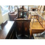 A 19th century rosewood corner cabinet