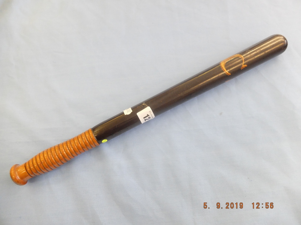 A Victorian turned hardwood truncheon painted with "CS", with ribbed handle,