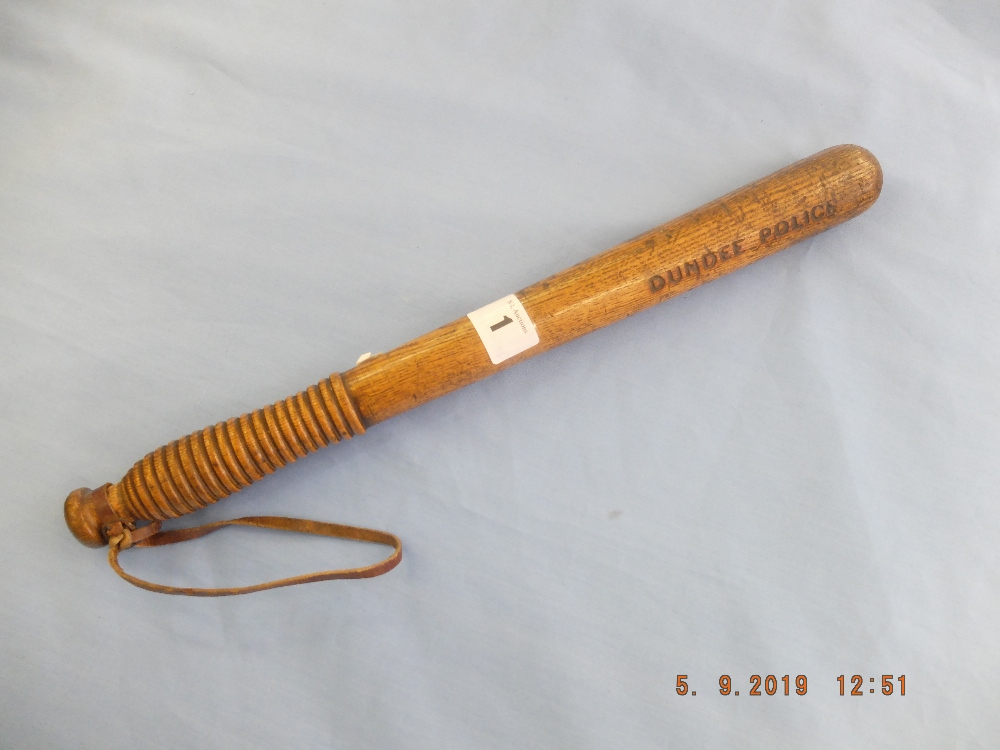 A late Victorian turned ash truncheon, stamped "Dundee Police",