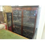 A mahogany glazed bookcase