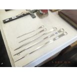 A set of four mid Victorian Elkington plate meat skewers and one other