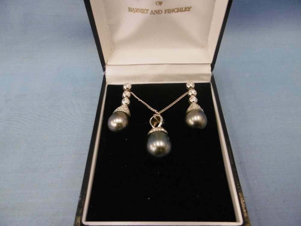 A pair Tahitian pearl and diamond drop earrings and matching necklace set in 18ct gold, 1.5ct.