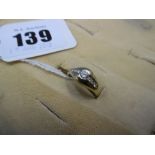 A small 18ct yellow gold diamond set ring
