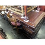 A red leather topped desk