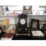 A 19th century French mantle clock in glass case