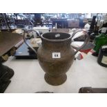 A twin handled copper pot