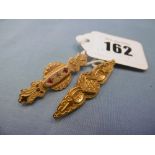 Two Victorian/Edwardian 9ct yellow gold bar brooches one set with two rubies and a diamond