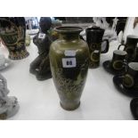An oriental brass vase