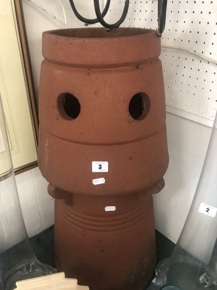 A large terracotta chimney