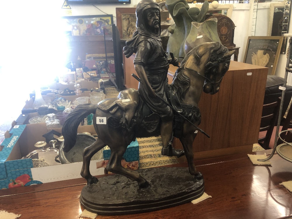 A bronze sculpture of Bedouin on horseback