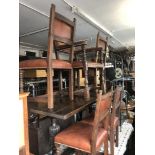 An oak refectory table and five chairs