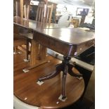 A 19th century foldover mahogany tea table