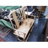 A pair of oriental elbow chairs