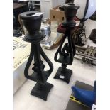 A pair of carved wood candlesticks