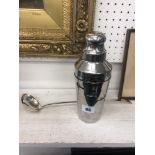 A vintage chrome cocktail shaker and a French silver plated toddy ladle