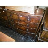A mahogany bow front chest of five drawers